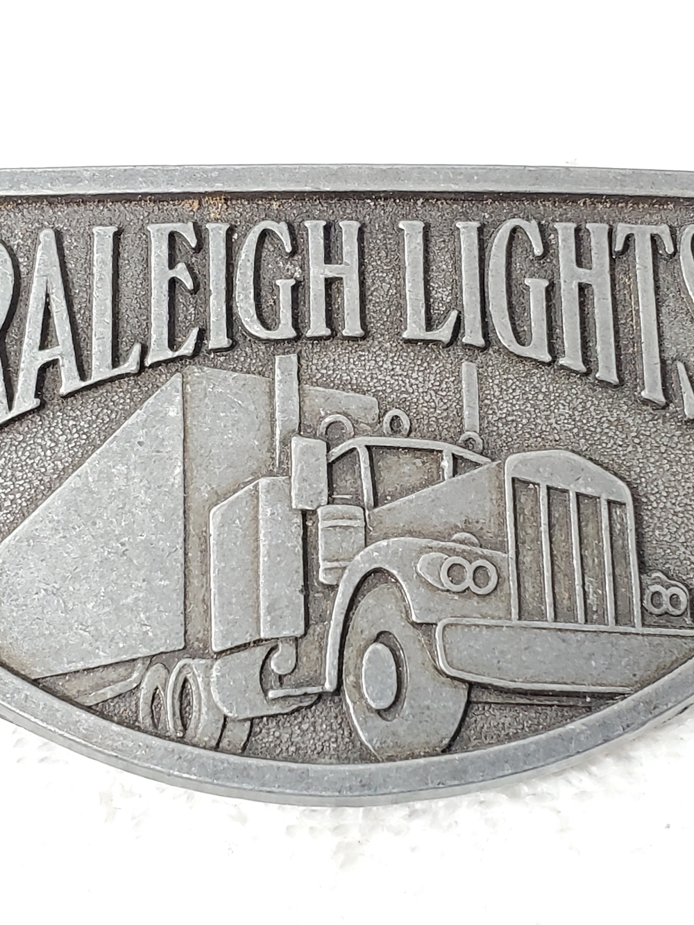 Vintage Raleigh Lights Semi Truck Tractor Trailer Promotional Belt Buckle